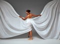 Ballerina Dancing with Silk Fabric, Modern Ballet Dancer in Fluttering Waving Cloth, Pointe Shoes, Gray Background Royalty Free Stock Photo