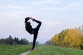 Ballerina dancing and stretching outdoor on sunny autumn day Royalty Free Stock Photo