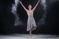 Ballerina dancing in studio with white flour Royalty Free Stock Photo