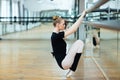 Ballerina doing stretching exercises Royalty Free Stock Photo