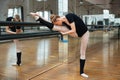 Ballerina doing stretching exercises Royalty Free Stock Photo