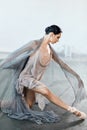 Ballerina dressed in scenic dress, is dancing in the studio. Body ballet and Art Royalty Free Stock Photo