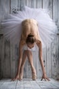 Ballerina dressed in white tutu makes lean forward Royalty Free Stock Photo