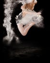 Ballet dancer ballerina jumping white powder Royalty Free Stock Photo