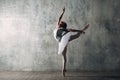 Ballerina female. Young beautiful woman ballet dancer, dressed in professional outfit, pointe shoes and white tutu. Royalty Free Stock Photo