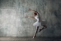 Ballerina female. Young beautiful woman ballet dancer, dressed in professional outfit, pointe shoes and white tutu. Royalty Free Stock Photo