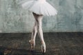 Ballerina female. Young beautiful woman ballet dancer, dressed in professional outfit, pointe shoes and white tutu. Royalty Free Stock Photo