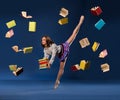 Ballerina in form of schoolgirl with pile books