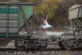 Ballerina between freight wagons Royalty Free Stock Photo