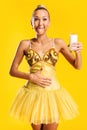 Ballerina with glass of milk or yoghurt