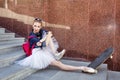 Ballerina hipster sits on the steps. Royalty Free Stock Photo