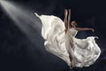 Ballerina Jumping in White Silk Dress, Modern Ballet Dancer in Pointe Shoes, Fluttering Waving Cloth, Gray Background Royalty Free Stock Photo