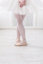 Ballerina legs closeup in fifth position Royalty Free Stock Photo