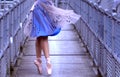 Ballerina on pedestrian bridge Royalty Free Stock Photo