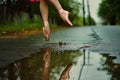 ballerina with pink shoes jumps over water puddle, midair