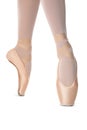 Ballerina in pointe shoe dancing on white background, closeup