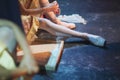 Ballerina in pointe shoes behind the scenes