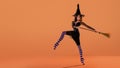 A ballerina on pointe shoes in a black witch costume in a hat and with a broom dances on an orange background