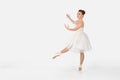 the ballerina in pointes and a dress dances on a white background Royalty Free Stock Photo