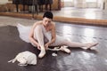 The ballerina puts on pointes Royalty Free Stock Photo