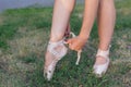 Ballerina puts on pointes on her legs Royalty Free Stock Photo