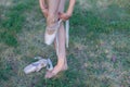 Ballerina puts on pointes on her legs Royalty Free Stock Photo