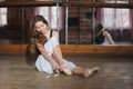 Ballerina putting on her ballet shoes Royalty Free Stock Photo