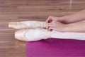 Ballerina putting on training slippers Royalty Free Stock Photo