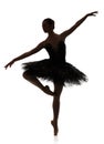 Ballerina silhouette making ballet pirouette against white background