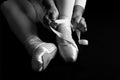 Ballerina sit down on floor to put on slippers prepare to perform artistic conversion Royalty Free Stock Photo