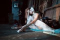 Ballerina sitting on the warm-up backstage Royalty Free Stock Photo