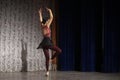 Ballerina spin. A girl in a black skirt is dancing on stage. Speech by a teenager in a dance class.