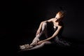 Ballerina tying pointe shoes. Royalty Free Stock Photo