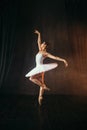 Ballerina in white dress and pointe shoes dancing Royalty Free Stock Photo