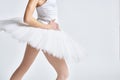 Ballerina white tutu dance exercise performance light background