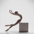 Ballerina. Young graceful female ballet dancer dancing at studio. Beauty of classic ballet.