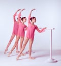 Ballerinas stretching on the bar Royalty Free Stock Photo