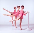 Ballerinas stretching on the bar Royalty Free Stock Photo