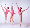 Ballerinas stretching on the bar Royalty Free Stock Photo