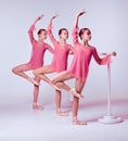 Ballerinas stretching on the bar Royalty Free Stock Photo