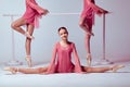 Ballerinas stretching on the bar Royalty Free Stock Photo