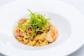 Ballerine pasta with shrimps in white plate