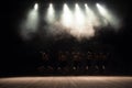 Ballet class on the stage of the theater with light and smoke. Children are engaged in classical exercise on stage