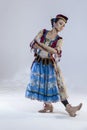 Ballet Concepts. Asian Japanese Female Ballet Dancer In Stage Outfit Costume Posing in Dance Pose With Patterns Over White