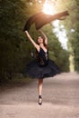 Ballet Dance Concepts. Professional Japanese Female Ballet Dancer Posing in Black Tutu With Veil Outdoor