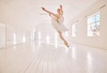 Ballet dance, jump and studio dancer dancing beautiful, elegant or classic performance in theater room. Stage artist Royalty Free Stock Photo