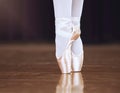 Ballet, dance and shoes with the feet of a ballerina or dancer dancing on a theater stage for a performance or show Royalty Free Stock Photo