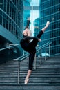 Ballet dancer on attitude pose on cuty street background Royalty Free Stock Photo