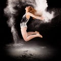 Ballet dancer ballerina jumping white powder Royalty Free Stock Photo