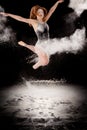 Ballet dancer ballerina jumping white powder Royalty Free Stock Photo